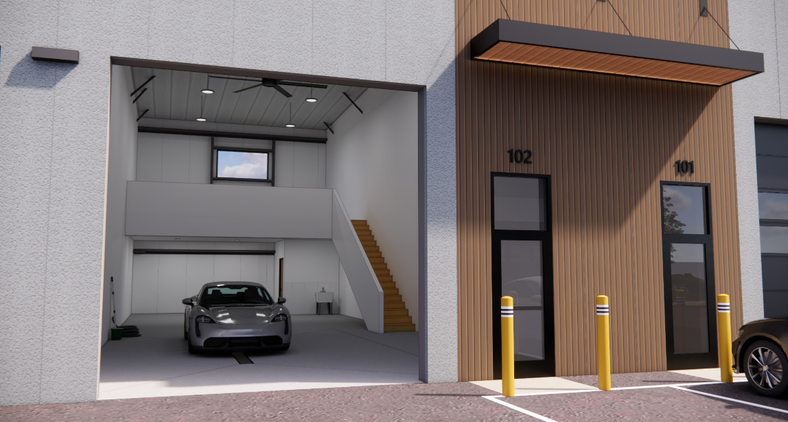 Commerce Square — close-up of an entry with the overhead door open, showing the finished mezzanine and stairs inside
